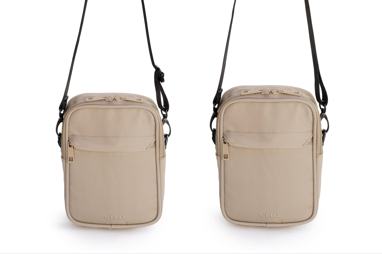 Two beige crossbody bags with black straps on a white background