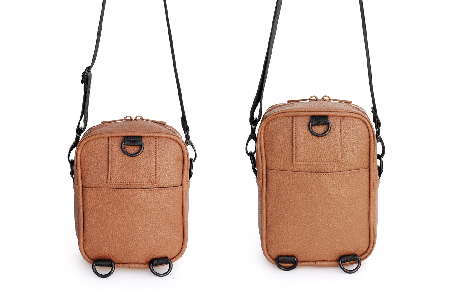 Two brown crossbody bags with black straps on a white background