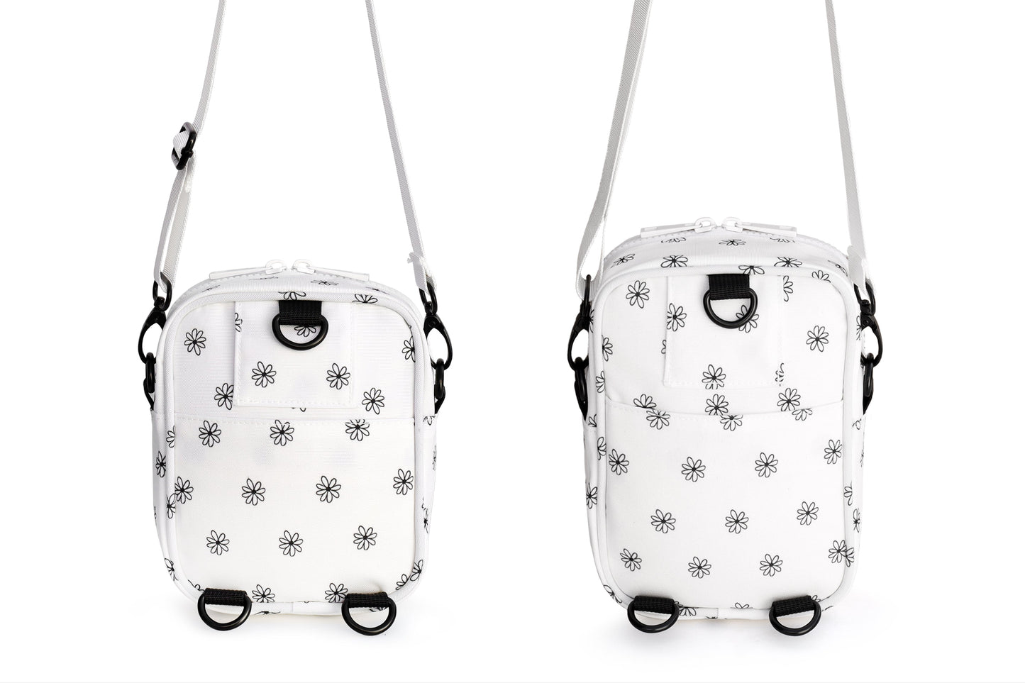 Two small white bags with black floral patterns on a white background