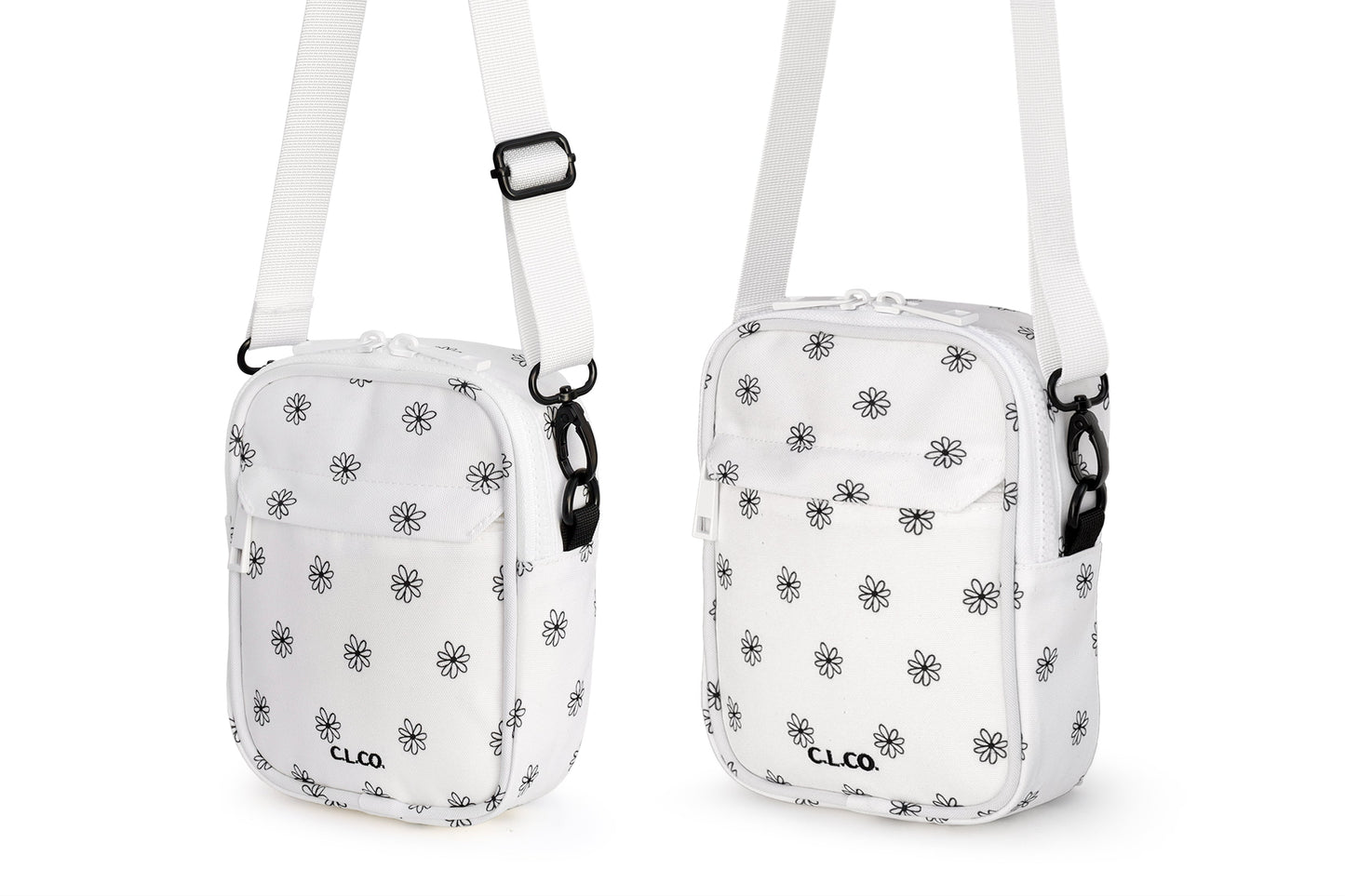 Two white crossbody bags with black floral patterns on a white background