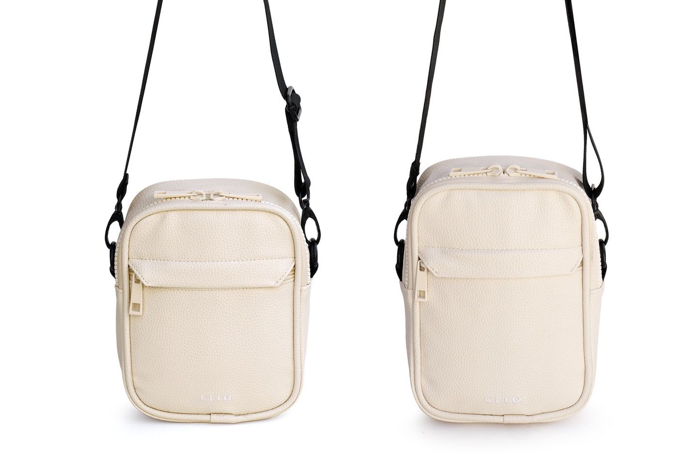 Two beige crossbody bags with black straps on a white background