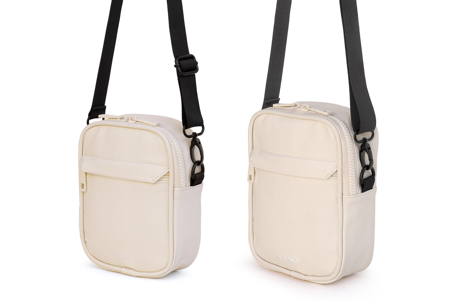 Two beige crossbody bags with black straps on a white background