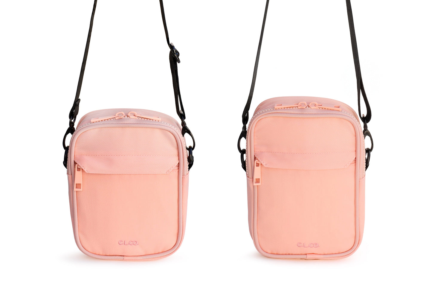 Two peach-colored crossbody bags with black straps on a white background