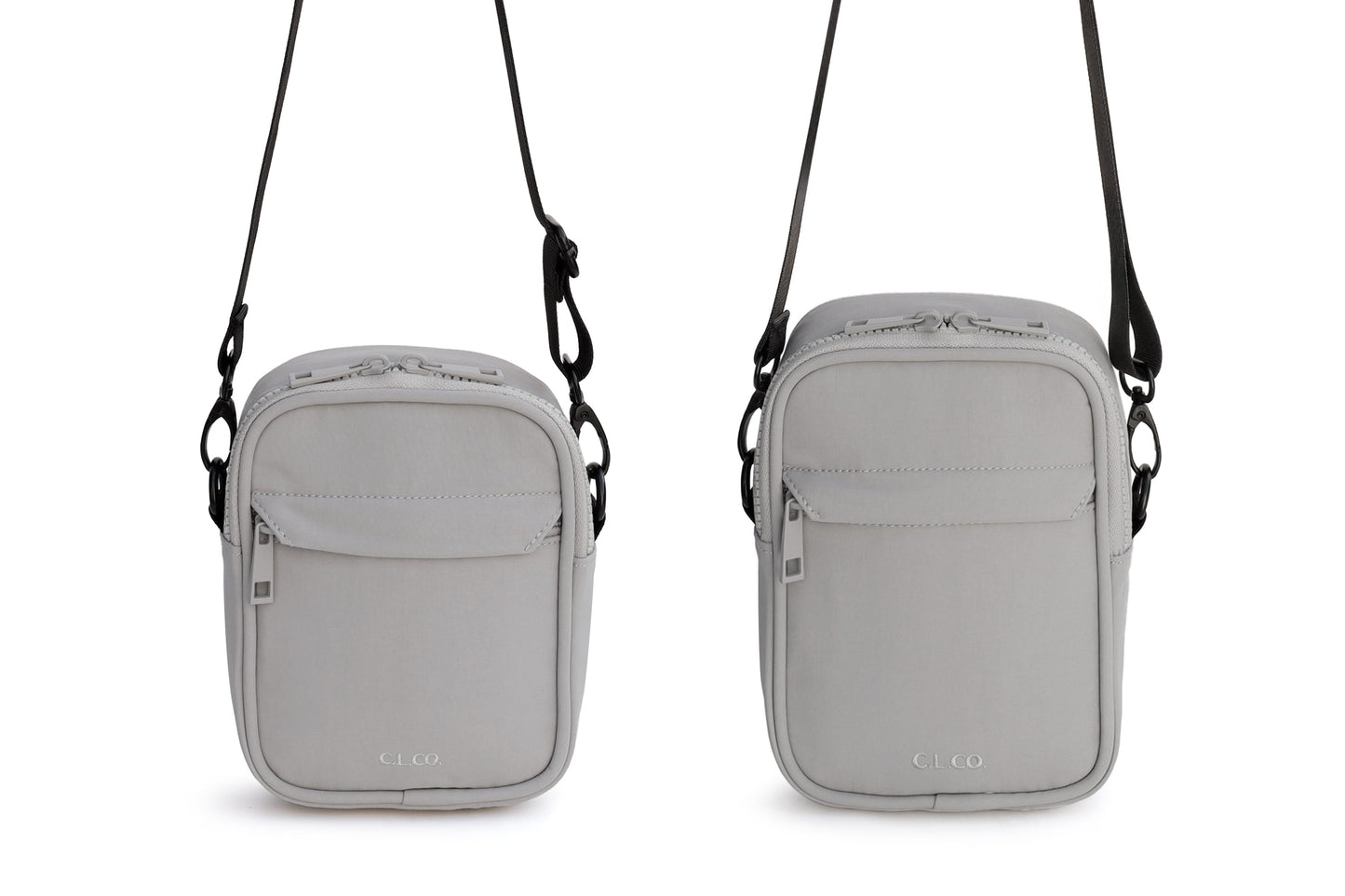 Two gray crossbody bags with straps on a white background