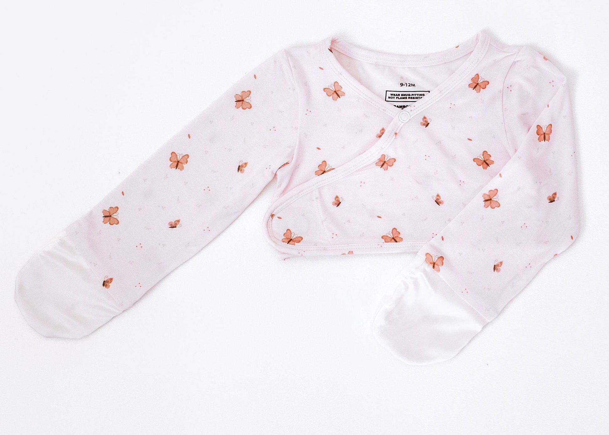 Baby cardigan with floral pattern on a white background
